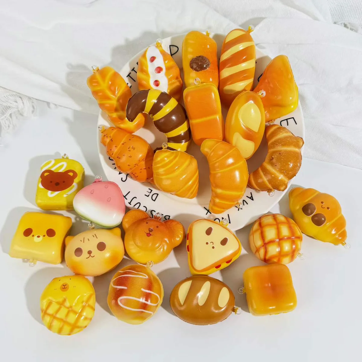 Bread and snack shaped squishy samples arranged together